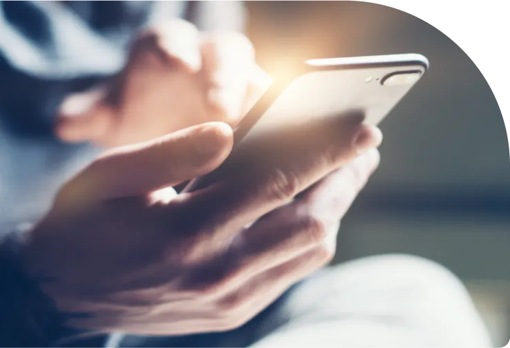 Hand holding a phone showing the Turbo Tide app
